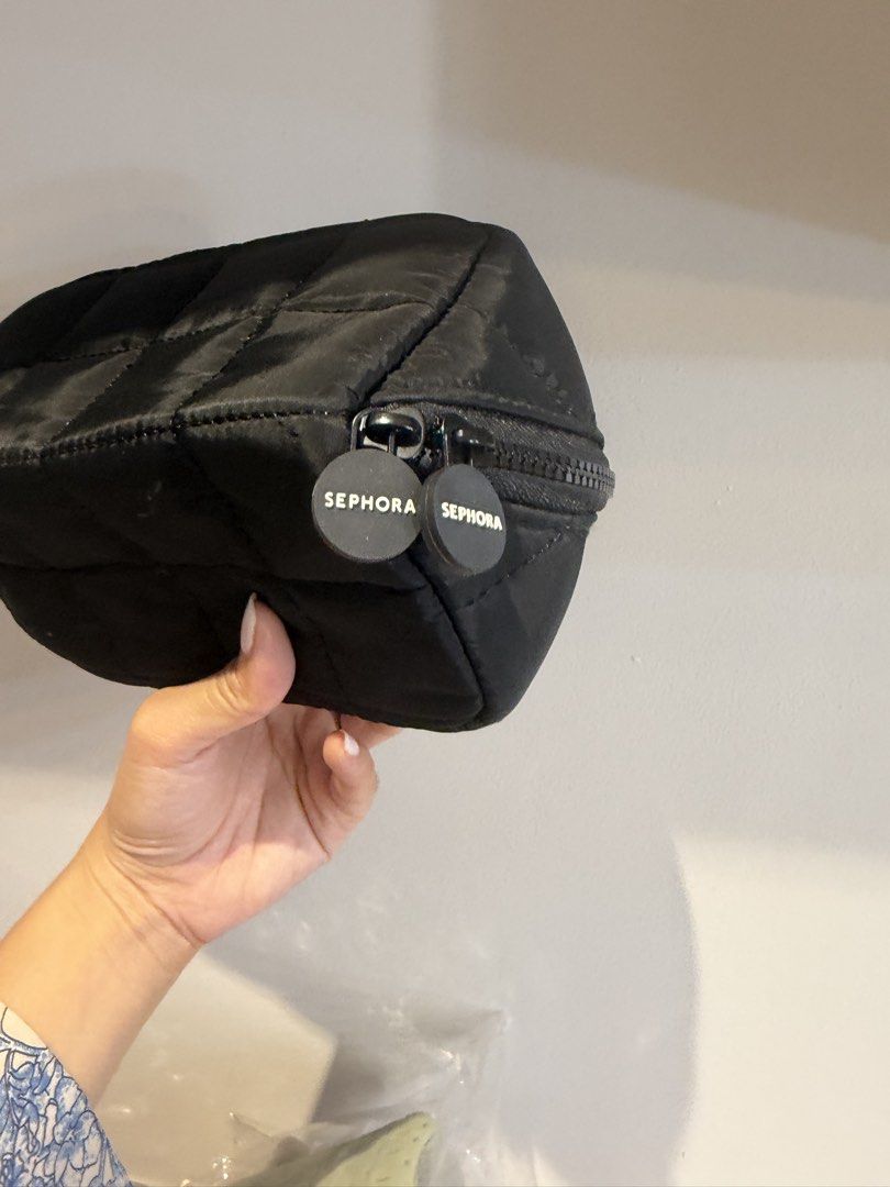 Sephora Quilted Cosmetic Bag (Category: Makeup) located in Quezon City. Submitted by destashingmycloset (Listing ID 1422860216, Image 2). Description: - Sephora black cosmetic bag - Quilted design - Zipper closure with two Sephora zipper pulls - Made of a nylon-like material - Compact size for makeup and small essentials.