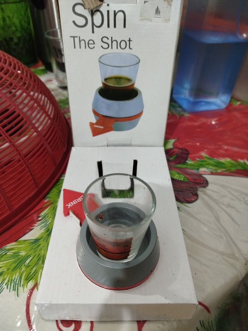 Shot Spinner Drinking Game (Category: Board Games & Puzzles) located in Manila. Submitted by anjiegadgets (Listing ID 1422803756, Image 2). Description: - Shot Spinner drinking game for instant fun! - Spin the arrow to determine who takes the shot. - Includes spinner base and shot glass. - Easy to play: just add your favorite drink! - Perfect for parties and gatherings..