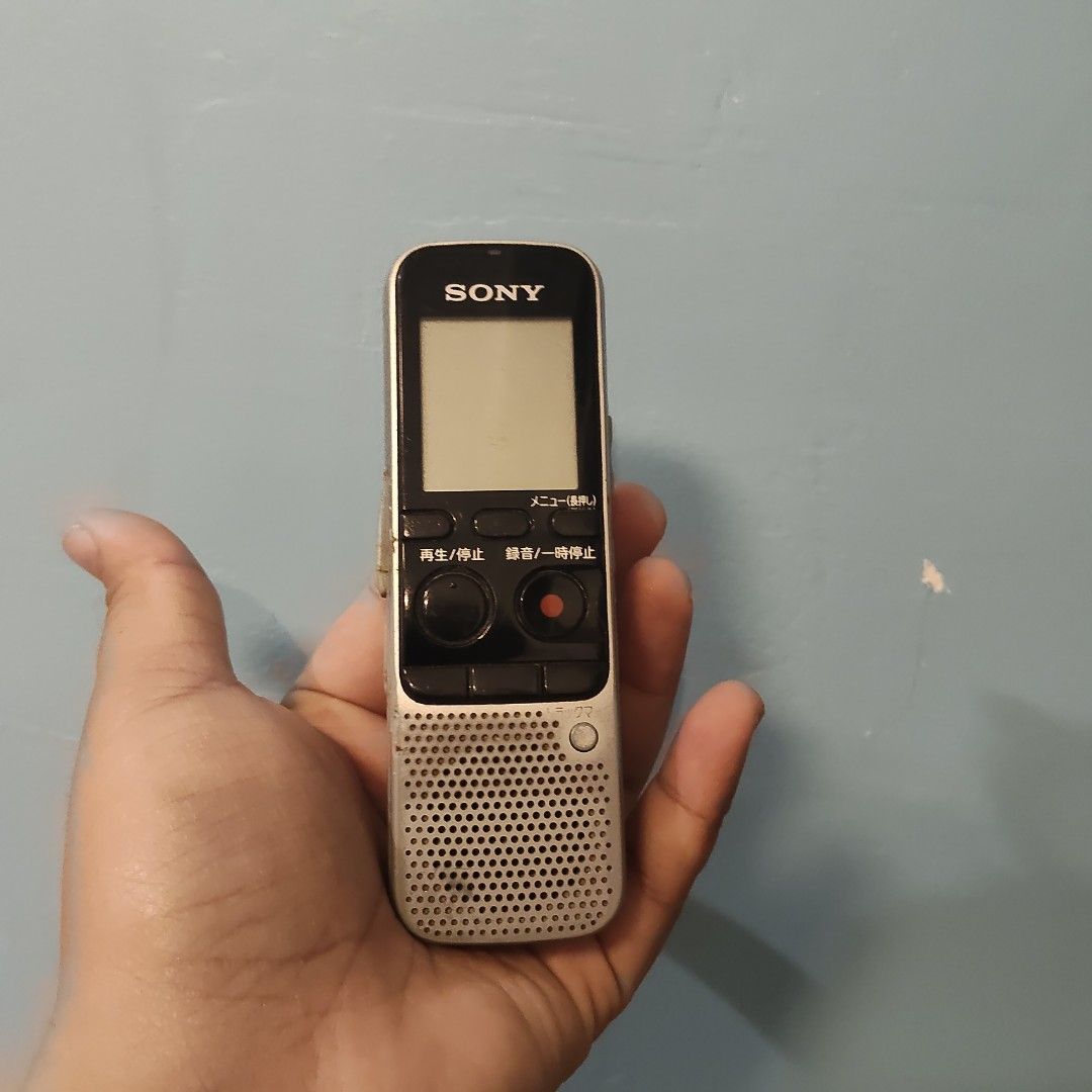 Sony IC Recorder (Category: Voice Recorders) located in Catbalogan. Submitted by jpnsrpls (Listing ID 1422891932, Image 2). Description: - Sony IC Recorder - Features a screen - Includes playback, stop, and record buttons - Volume controls on the side - 'Plug in Power' port and 'Open' indicator on the back - Color: Silver and Black.