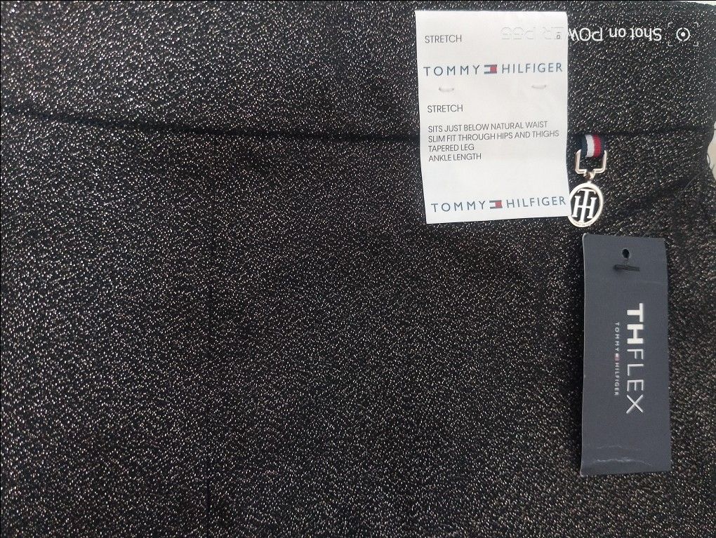 Tommy Hilfiger TH Flex Ankle Length Pants (Category: Other Bottoms) located in Binan City. Submitted by stuffshop29 (Listing ID 1422825446, Image 2). Description: - Tommy Hilfiger TH Flex ankle pants - Size 8 - Slim fit - Stretch fabric - Sits below natural waist - Made in Vietnam - Original retail price: $89.00.
