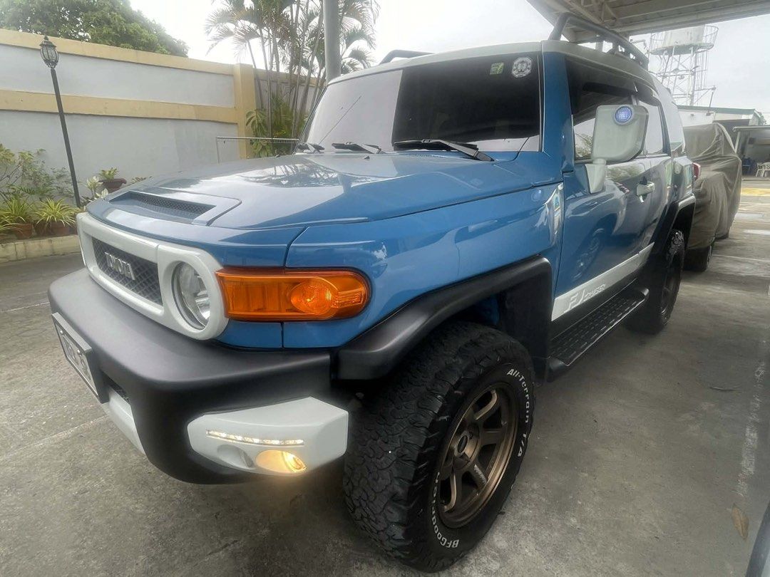 Toyota FJ Cruiser (Category: Used Cars) located in Quezon City. Submitted by sabine23 (Listing ID 1422903121, Image 2). Description: 2016 Toyota FJ Cruiser,Automatic, Color Blue 4x4,gas,16,611 kms mileage 2 inch lift,m(jaos)w/ volk rays mags(bronze),center caps original.