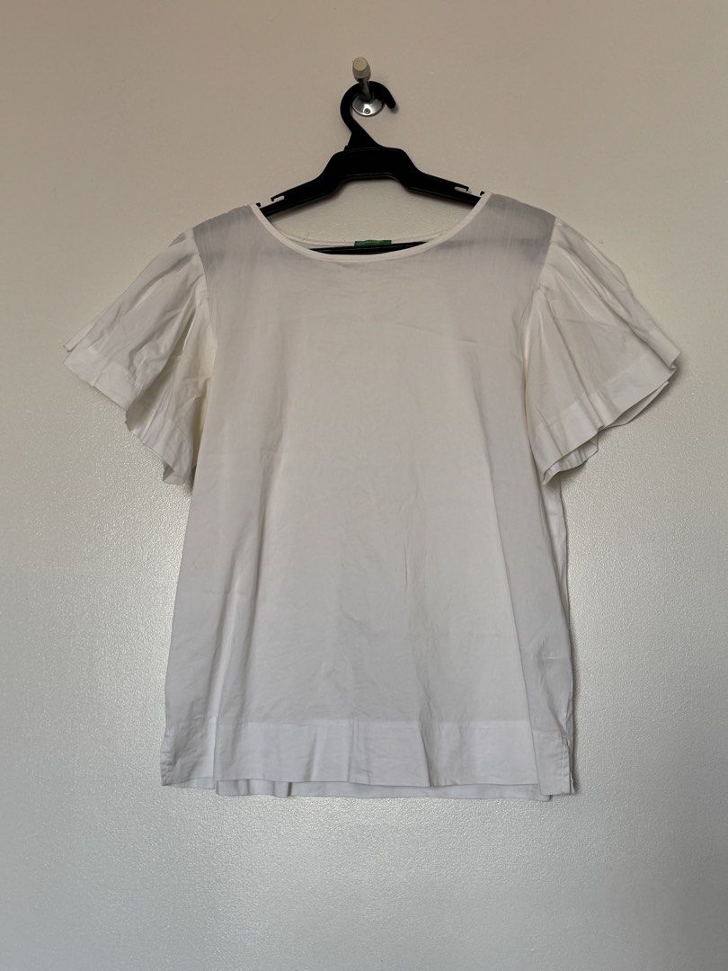 White ruffle blouse (Category: Blouses) located in Makati City. Submitted by pattystuff (Listing ID 1422763575, Image 1). Description: - White blouse with flutter sleeves - Best fit M to L - Needs washing - Pre-loved, please manage expectations.