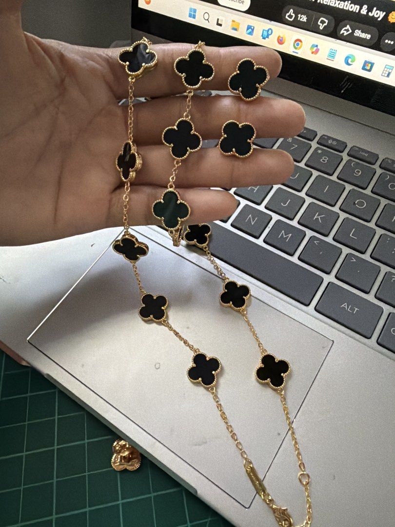 Van Cleef & Arpels Alhambra Jewelry Set. (Category: Necklaces) located in Caloocan City. Submitted by emz.collection (Listing ID 1422754305, Image 3). Description: - Van Cleef & Arpels Alhambra jewelry set - Includes necklace, bracelet, and earrings - Features iconic clover design - Crafted with black onyx stones - Set in gold - Adds a touch of luxury to any look.