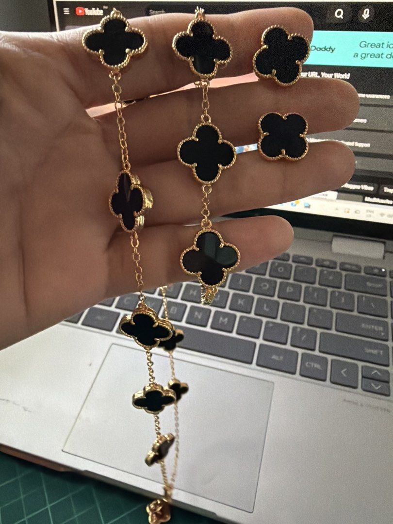 Van Cleef & Arpels Alhambra Jewelry Set. (Category: Necklaces) located in Caloocan City. Submitted by emz.collection (Listing ID 1422754305, Image 2). Description: - Van Cleef & Arpels Alhambra jewelry set - Includes necklace, bracelet, and earrings - Features iconic clover design - Crafted with black onyx stones - Set in gold - Adds a touch of luxury to any look.