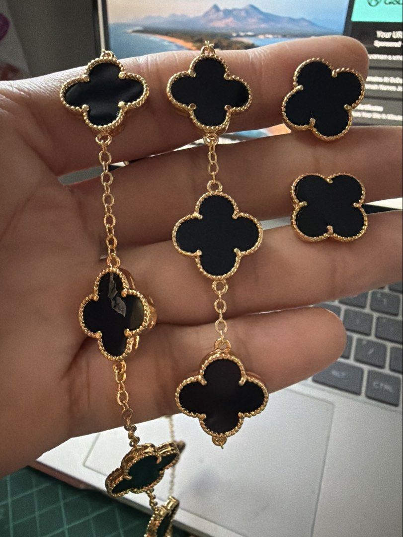 Van Cleef & Arpels Alhambra Jewelry Set. (Category: Necklaces) located in Caloocan City. Submitted by emz.collection (Listing ID 1422754305, Image 1). Description: - Van Cleef & Arpels Alhambra jewelry set - Includes necklace, bracelet, and earrings - Features iconic clover design - Crafted with black onyx stones - Set in gold - Adds a touch of luxury to any look.