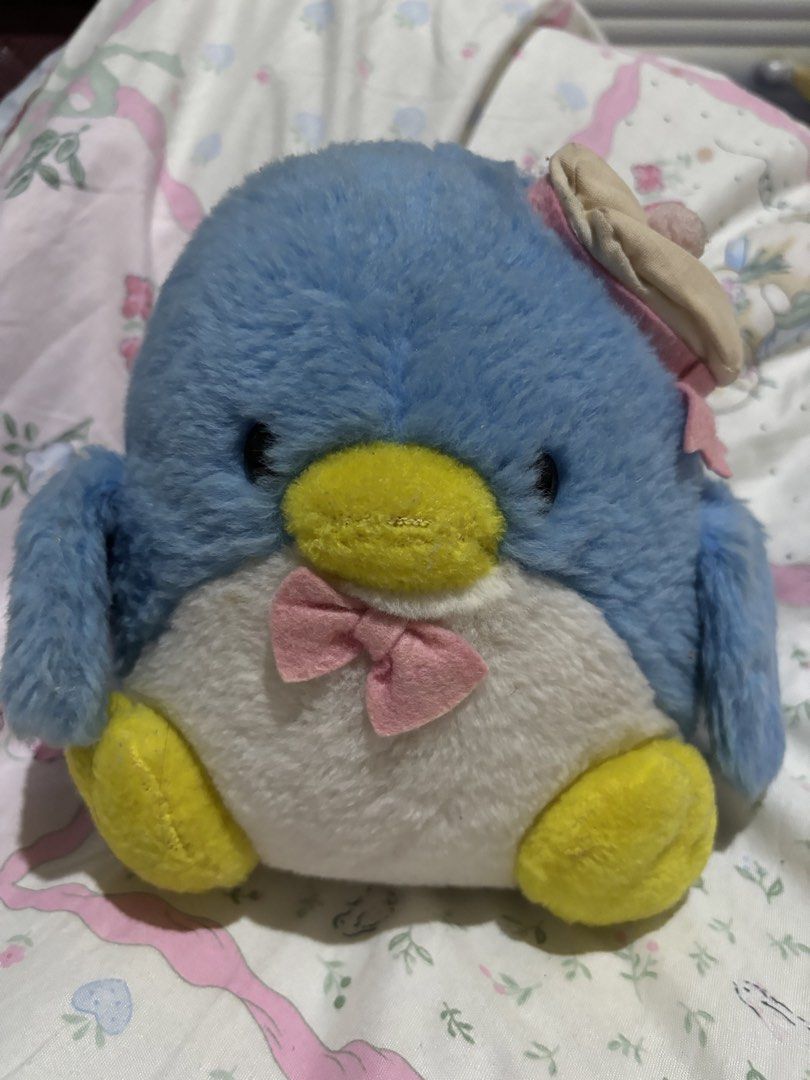 Vintage Tuxedo Sam Plush Toy (Category: Plushies & Soft Toys) located in Manila. Submitted by meloopsy (Listing ID 1422896418, Image 1). Description: - Adorable vintage Tuxedo Sam plush toy. - Features: - Blue body - White belly - Yellow feet and beak - Pink bow tie - Small hat with pink pom-pom - Perfect for collectors and fans of cute, nostalgic items..