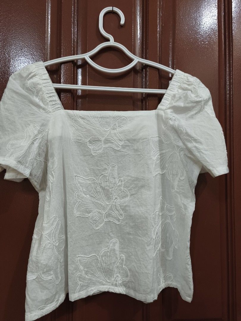 Plains & Prints White Embroidered Square Neck Top (Category: Blouses) located in Legazpi City. Submitted by fhlorms (Listing ID 1422859303, Image 1). Description: White top with square neckline, short sleeves, and embroidered floral design. Lightweight fabric, perfect for warm weather. Versatile style. Could be worn as modern Filipiniana. No to worn please. RfS: Bought then washed and turned a bit small for my fit. Just recently bought (see pic o
