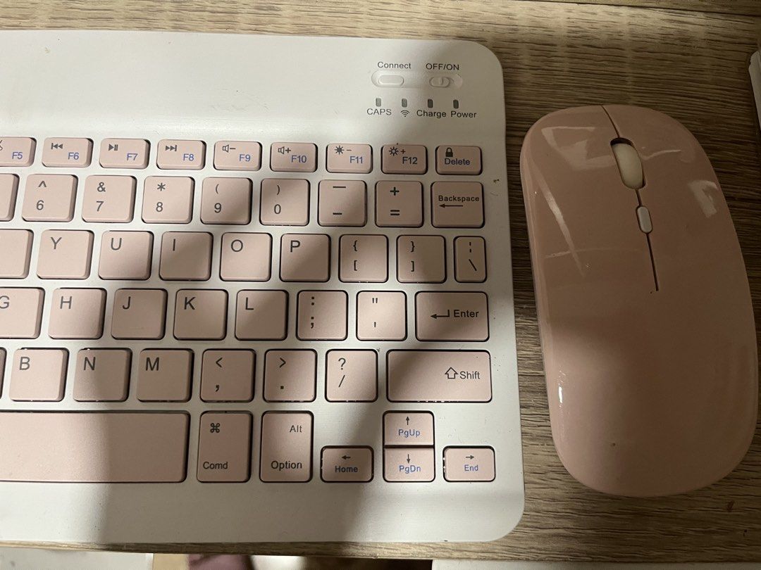 Wireless Keyboard and Mouse Set - Pink (Category: Computer Keyboard) located in Cavite. Submitted by rcamii (Listing ID 1422821120, Image 3). Description: - Stylish pink wireless keyboard and mouse set. - Keyboard features a standard layout with function keys. - Includes indicator lights for Caps Lock, charging, and power. - Mouse has a simple design with a scroll wheel and two buttons. - Designed for ease of use and portability..