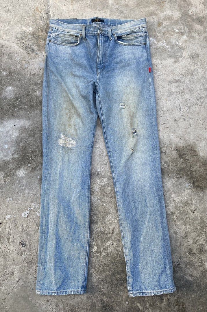 WTAPS Distressed Jeans (Category: Jeans) located in Quezon City. Submitted by yricbugayo66048 (Listing ID 1422809650, Image 1). Description: - Light blue WTAPS jeans - Distressed design - Red tag detail - Leather WTAPS logo patch - Classic five-pocket design - Straight leg fit - Faded wash on back - Size tag visible in photos.