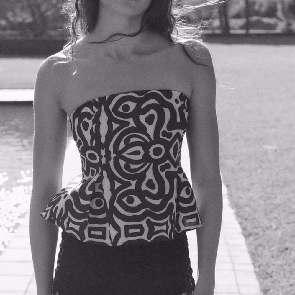 Zara Printed Tube Top (Category: Others Tops) located in Manila. Submitted by iluvbiscoffcookie (Listing ID 1422884807, Image 1). Description: Zara tube top 🤍 - Size: L - Unique black and white print - Flattering peplum design - Perfect for a chic and trendy look 💕💕 - theres a very small pink stains (can be seen in last pic) but not really obvious!.