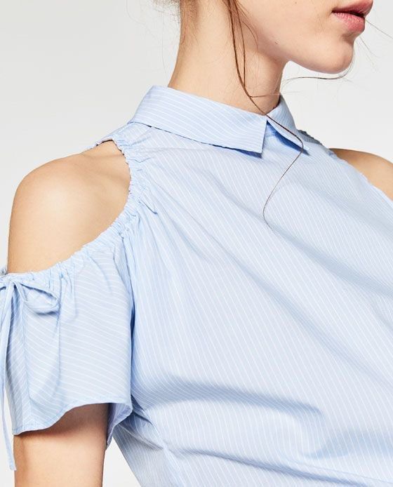 Zara Striped Cold Off Shoulder Top Blouse (Category: Blouses) located in Rodriguez. Submitted by alekshivers (Listing ID 1422869897, Image 3). Description: - Zara striped top - Light blue and white - Collared neckline - Cold shoulder design - Tie details on sleeves - Short sleeves - Slightly gathered waist - Keyhole back detail - Lightweight fabric -xs to small fit.