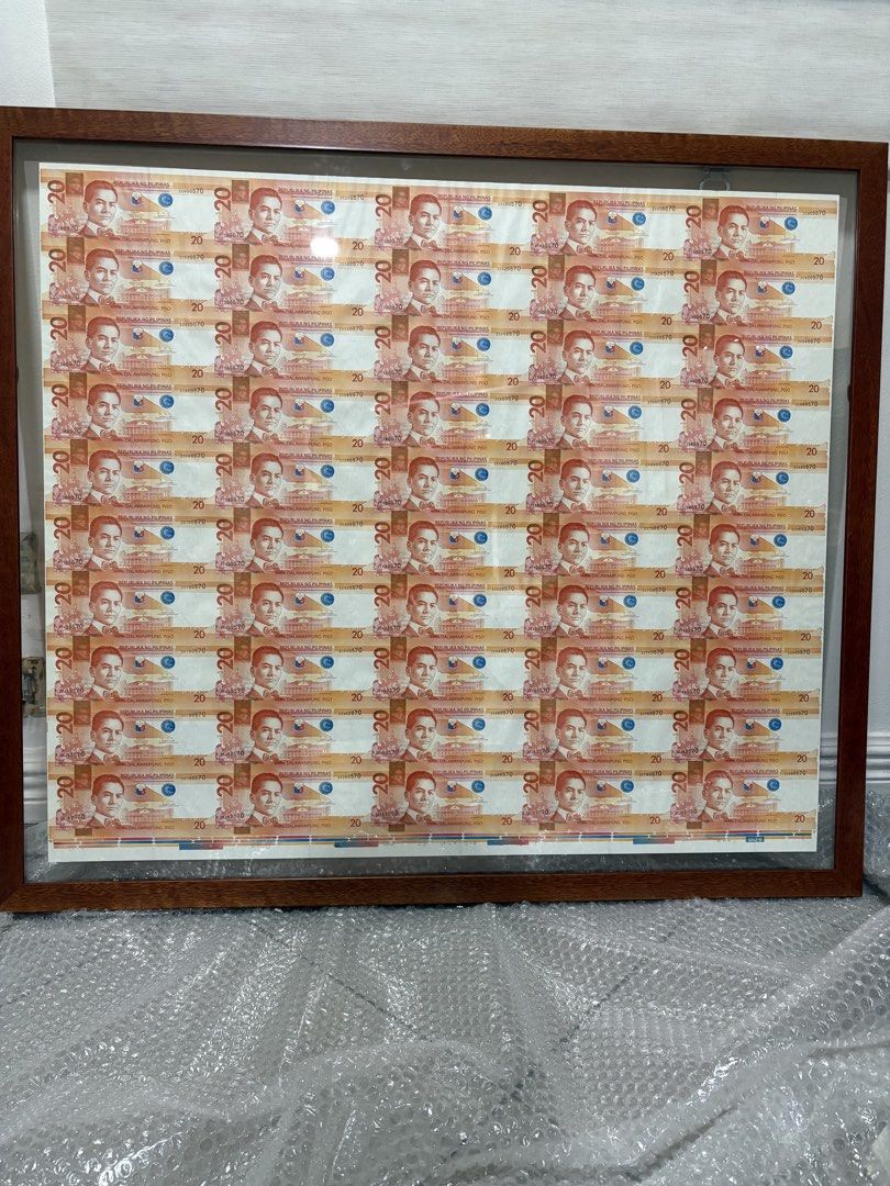 20 Peso Uncut Banknotes (50 pcs) (Category: Currency) located in Mandaluyong City. Submitted by bethankful1805 (Listing ID 1422907043, Image 1). Description: - Framed collection of twenty-peso banknotes. - Wooden frame with glass cover. - Twenty banknotes arranged in a grid. 20 peso uncut 50pcs.
