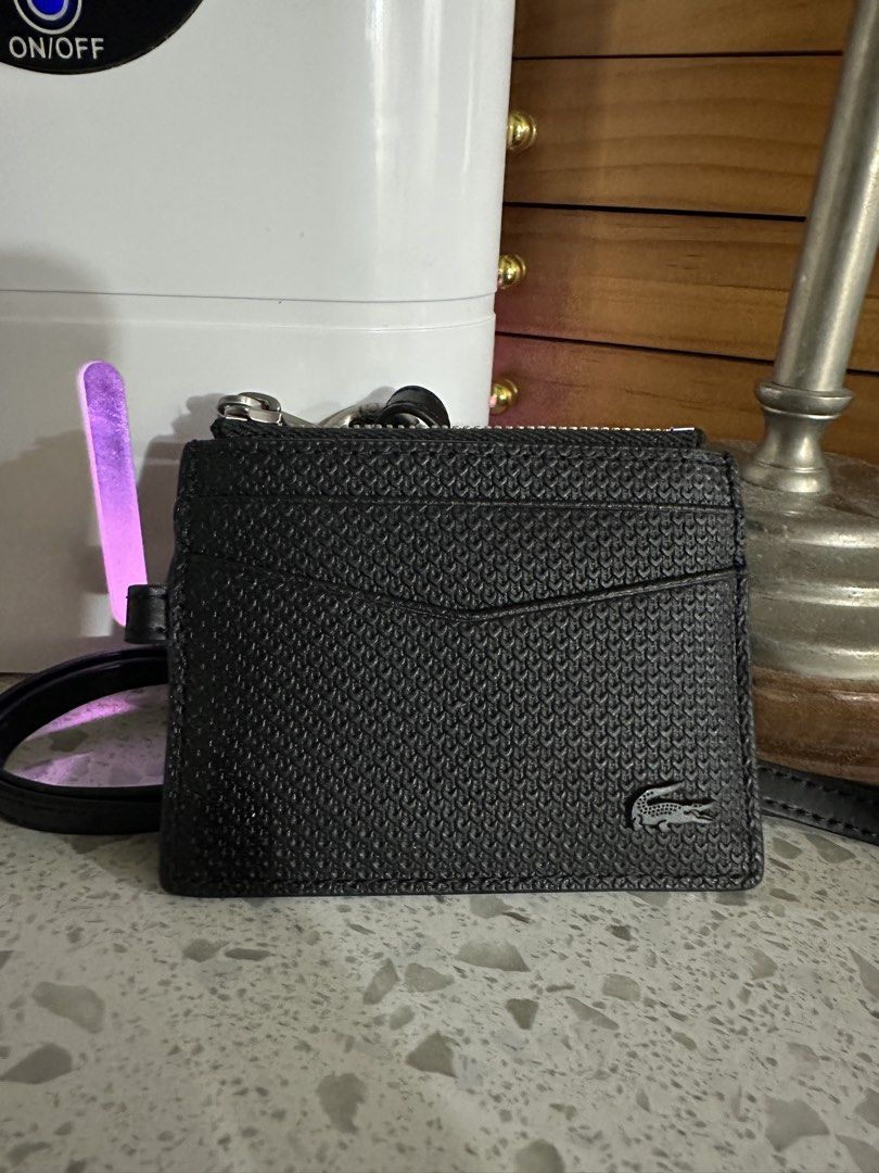 Authentic Lacoste Card case with strap (Category: Luxury Bags & Wallets) located in Malabon City. Submitted by vintagemom (Listing ID 1422966951, Image 1). Description: Guaranteed authentic Bought in store for P4500 No more box and paper bag .
