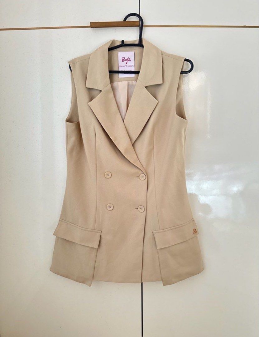 Barbie Sleeveless Blazer and Pants Set (Category: Sets or Coordinates) located in Daet. Submitted by jnbns (Listing ID 1422937631, Image 1). Description: - Barbie suit set - Sleeveless blazer with double-breasted design - Blazer features two pockets - Matching straight-leg pants - Light beige color - Perfect for a chic and stylish look.