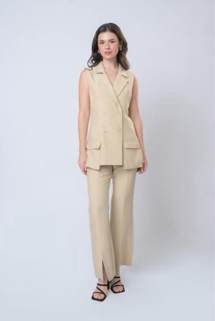 Barbie Sleeveless Blazer and Pants Set (Category: Sets or Coordinates) located in Daet. Submitted by jnbns (Listing ID 1422937631, Image 3). Description: - Barbie suit set - Sleeveless blazer with double-breasted design - Blazer features two pockets - Matching straight-leg pants - Light beige color - Perfect for a chic and stylish look.