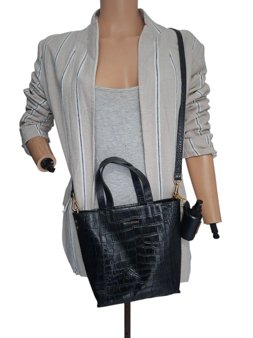 Marja Kurki - Black Croc-Embossed 2Way Bag (Category: Tote Bags) located in Rizal. Submitted by KCS0001 (Listing ID 1422973959, Image 1). Description: - With minimal flaws (rubber lining issue - body and handles) -- selling low - 1800 down to 1300 - Black 2way bag - Croc-embossed texture - Top handle and detachable shoulder strap - Gold-toned hardware - Structured design - Suitable for everyday use.