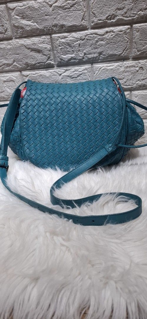 Bottega Veneta Woven Shoulder Bag (Category: Luxury Bags & Wallets) located in Baguio. Submitted by jhaz_bags (Listing ID 1423030927, Image 1). Description: - Authentic Bottega Veneta shoulder bag - Teal woven design - Drawstring closure - Includes shoulder strap ver good condition - Interior zippered pocket - Light brown suede-like lining - Brand tag and serial number included.