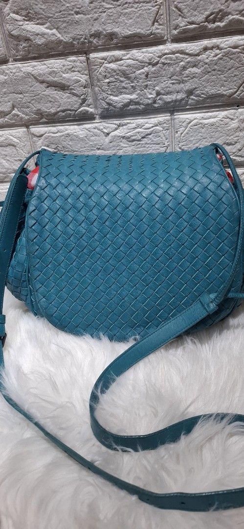 Bottega Veneta Woven Shoulder Bag (Category: Luxury Bags & Wallets) located in Baguio. Submitted by jhaz_bags (Listing ID 1423030927, Image 2). Description: - Authentic Bottega Veneta shoulder bag - Teal woven design - Drawstring closure - Includes shoulder strap ver good condition - Interior zippered pocket - Light brown suede-like lining - Brand tag and serial number included.