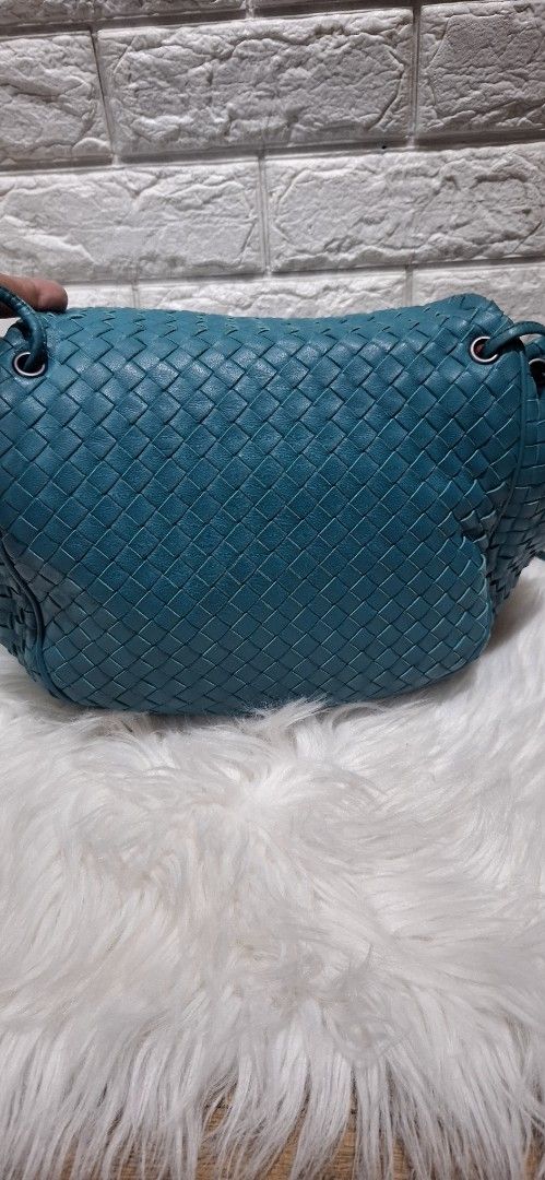 Bottega Veneta Woven Shoulder Bag (Category: Luxury Bags & Wallets) located in Baguio. Submitted by jhaz_bags (Listing ID 1423030927, Image 3). Description: - Authentic Bottega Veneta shoulder bag - Teal woven design - Drawstring closure - Includes shoulder strap ver good condition - Interior zippered pocket - Light brown suede-like lining - Brand tag and serial number included.