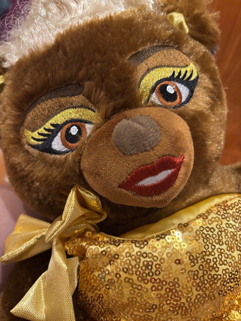 Build-A-Bear RuPaul Plush Teddy Bear (Category: Plushies & Soft Toys) located in Quezon City. Submitted by sharlene815 (Listing ID 1422911425, Image 2). Description: - Build-A-Bear RuPaul plush - Features a gold sequined dress and wig - Detailed makeup - Brown bear with blonde wig - Includes a bow - New with tag.