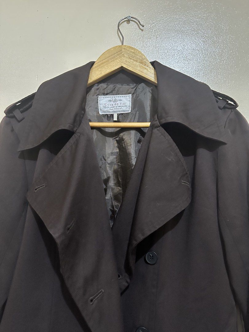 Casa di Moda Dark Brown Trench Coat (Category: Coats, Jackets and Outerwear) located in Pasay City. Submitted by jowannabe (Listing ID 1422913576, Image 3). Description: - Casa di Moda trench coat - Double-breasted design - Button closures - Shoulder epaulettes - Adjustable cuffs - Tailored fit - Mid-length cut - Made of dark, smooth fabric - Perfect for layering - Best fit for Medium to Large.