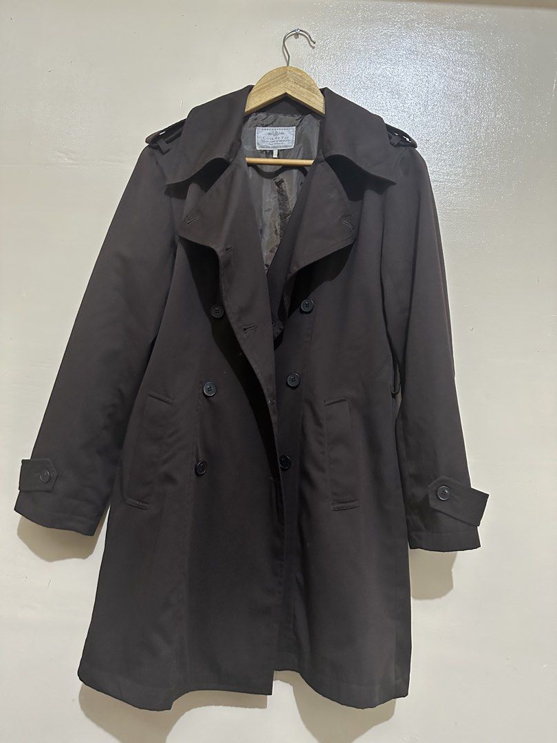 Casa di Moda Dark Brown Trench Coat (Category: Coats, Jackets and Outerwear) located in Pasay City. Submitted by jowannabe (Listing ID 1422913576, Image 1). Description: - Casa di Moda trench coat - Double-breasted design - Button closures - Shoulder epaulettes - Adjustable cuffs - Tailored fit - Mid-length cut - Made of dark, smooth fabric - Perfect for layering - Best fit for Medium to Large.