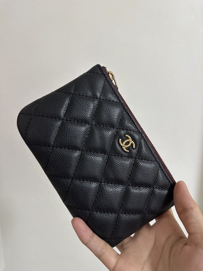 Chanel Caviar Quilted Coin Purse (Category: Luxury Bags & Wallets) located in Cavite. Submitted by luxedesign25 (Listing ID 1422940772, Image 1). Description: - Chanel coin purse - Black quilted caviar leather - Gold-tone CC logo - Gold-tone zipper - Burgundy fabric lining - Minimal wear.