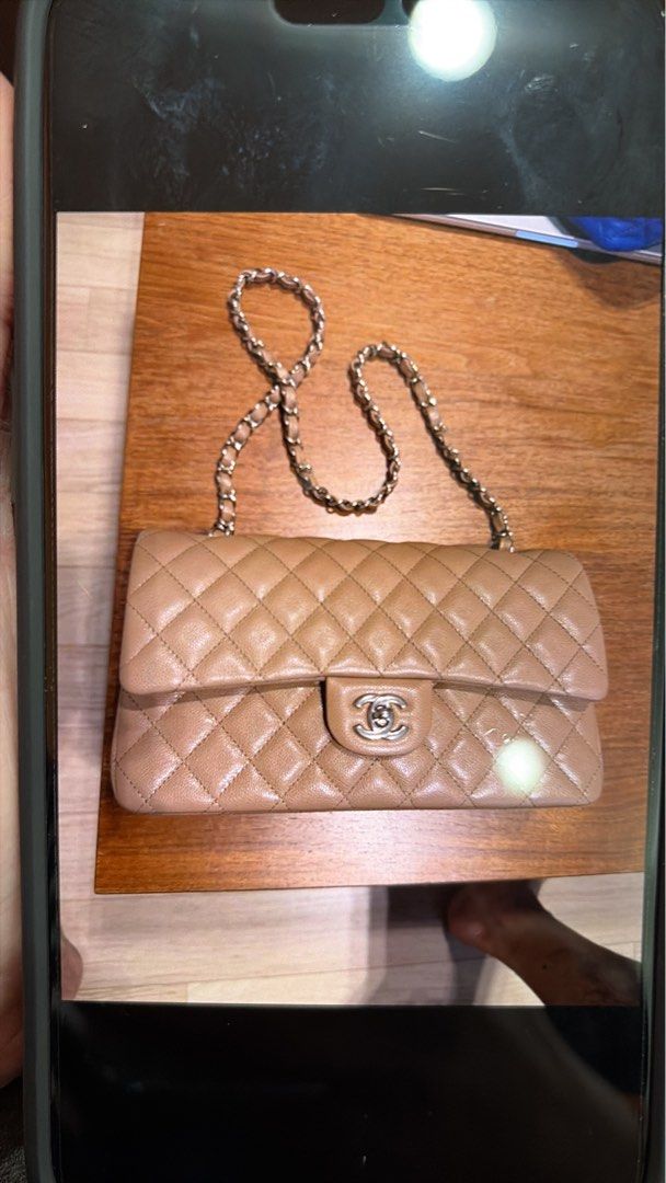 Chanel Classic Flap Bag (Category: Luxury Bags & Wallets) located in Makati City. Submitted by mnlbeautyboutique (Listing ID 1422932515, Image 1). Description: - Authentic Chanel flap bag - Quilted design - Elegant chain strap - Iconic turn-lock closure with Chanel logo - Color: Light brown/beige Bought for 88,700HKD selling for only Php490k.