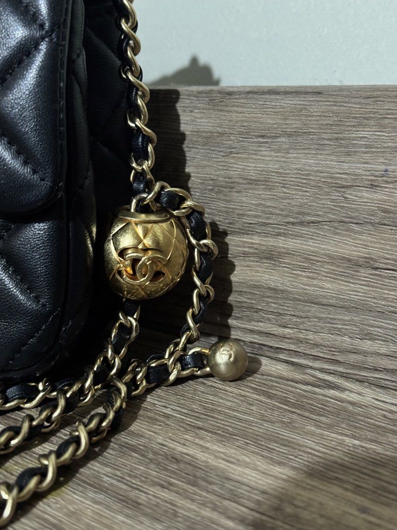 Chanel Mini rectangular pearl flap (Category: Luxury Bags & Wallets) located in Santa Barbara. Submitted by elleemmnnop (Listing ID 1423035376, Image 3). Description: - Chanel Mini rectangular pearl Flap Bag - Quilted lamb skin design - Gold-tone chain strap with ball detail - Classic CC turn-lock closure - Interior: Main compartment and zippered pocket - Made in Italy - Serial number: 25463188 - Japan sourced preloved - NGA - minor flaw on back 