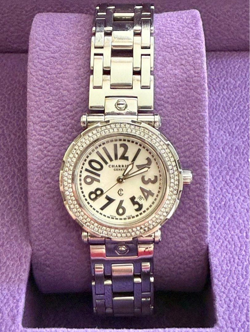 Charriol Geneva Diamond Watch 30mm (Category: Women's Watches) located in Manila. Submitted by moiluxe (Listing ID 1422946925, Image 1). Description: - Charriol Geneva watch - Diamond-studded bezel - White dial with black numerals - Date display - Stainless steel bracelet - Secure clasp - Includes original purple box - Charriol logo and details engraved on the back.