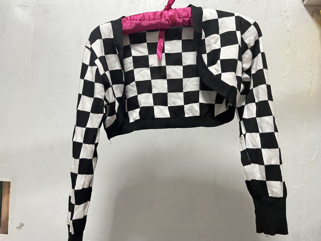 Checkered Dress with Bolero (Category: Dresses) located in Manila. Submitted by declutter_w_sam (Listing ID 1423030632, Image 3). Description: - Stylish checkered dress with a matching bolero. - Dress features a square neckline and spaghetti straps. - Bolero has long sleeves. - Black and white checkered pattern. - Perfect for a chic and trendy look..
