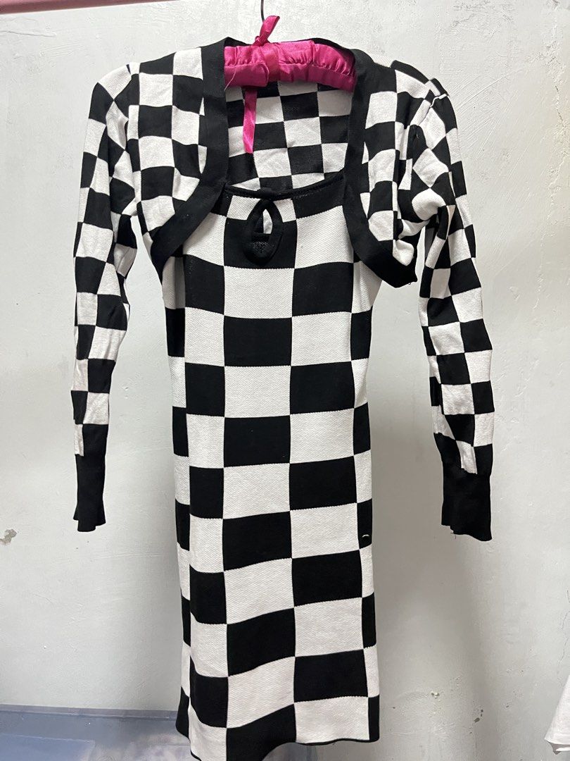 Checkered Dress with Bolero (Category: Dresses) located in Manila. Submitted by declutter_w_sam (Listing ID 1423030632, Image 1). Description: - Stylish checkered dress with a matching bolero. - Dress features a square neckline and spaghetti straps. - Bolero has long sleeves. - Black and white checkered pattern. - Perfect for a chic and trendy look..