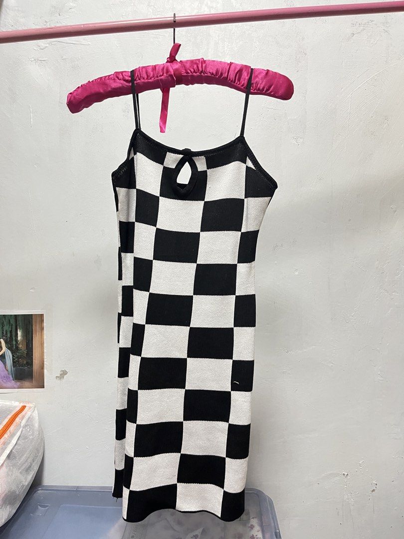 Checkered Dress with Bolero (Category: Dresses) located in Manila. Submitted by declutter_w_sam (Listing ID 1423030632, Image 2). Description: - Stylish checkered dress with a matching bolero. - Dress features a square neckline and spaghetti straps. - Bolero has long sleeves. - Black and white checkered pattern. - Perfect for a chic and trendy look..