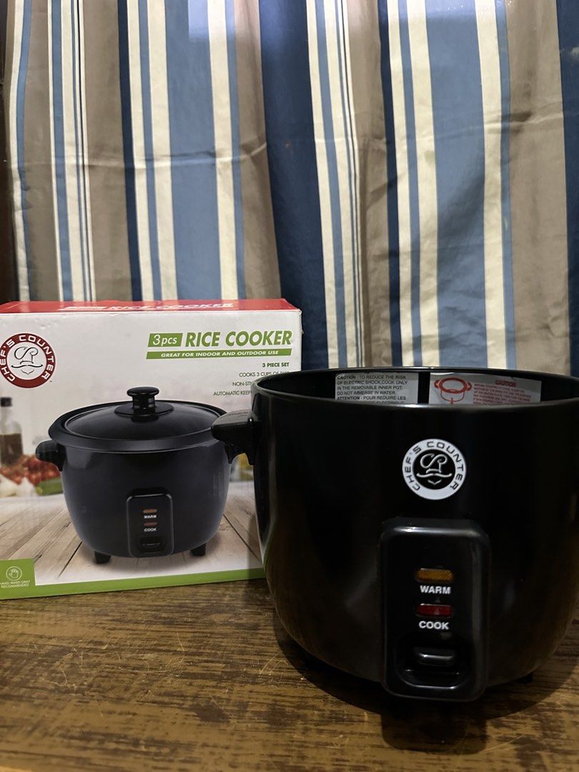 Chef's Counter 3-Piece Rice Cooker (Category: Cookers) located in Cavite. Submitted by veinnn (Listing ID 1423004372, Image 2). Description: Chef's Counter rice cooker is a 3-piece set, perfect for indoor and outdoor use. It cooks up to 3 cups of rice and features a non-stick cooking pot and an automatic keep-warm function. The cooker has a black exterior and includes a lid..