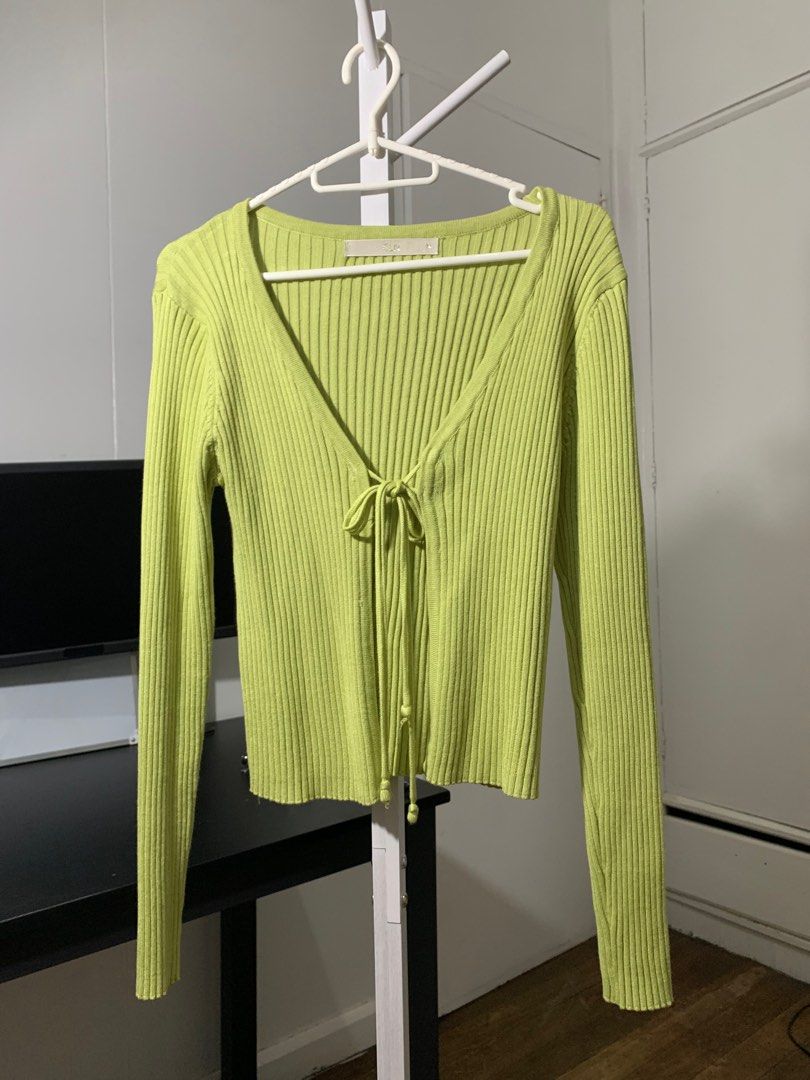 CLN Ribbed Tie-Front Cardigan (Category: Sleeveless) located in Quezon City. Submitted by declutterwithm (Listing ID 1423019487, Image 1). Description: - Ribbed design - Tie-front closure - Long sleeves - Vibrant green color - Size M - Dress up or down.