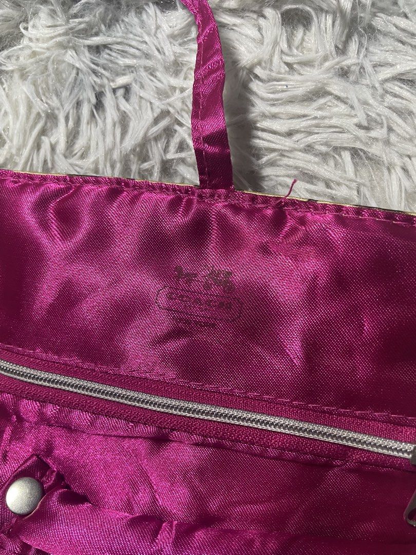 Coach Wallet (Category: Luxury Bags & Wallets) located in Trece Martires City. Submitted by zav_vinny (Listing ID 1423037864, Image 3). Description: - Coach wallet with signature logo pattern (brown and gold). - Vibrant pink interior. - Includes a zippered compartment. - Secure snap closure. - Comes with a strap. - Compact and stylish design. - still nego.