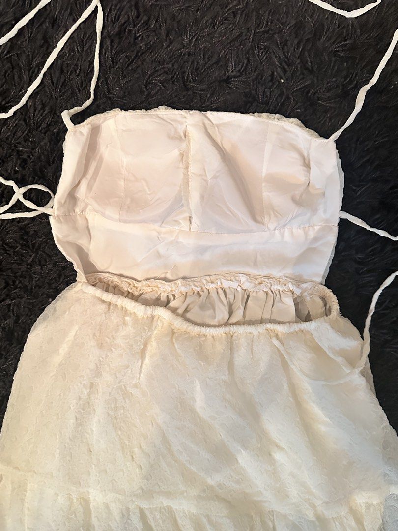 Cream Backless Self-Tie Tiered Dress (Category: Dresses) located in Pasay City. Submitted by a.daneee (Listing ID 1423020094, Image 2). Description: - Cream backless dress - Tiered design, midi length - Textured fabric, stretchable - Self tie straps Bought in Vietnam! Never used.