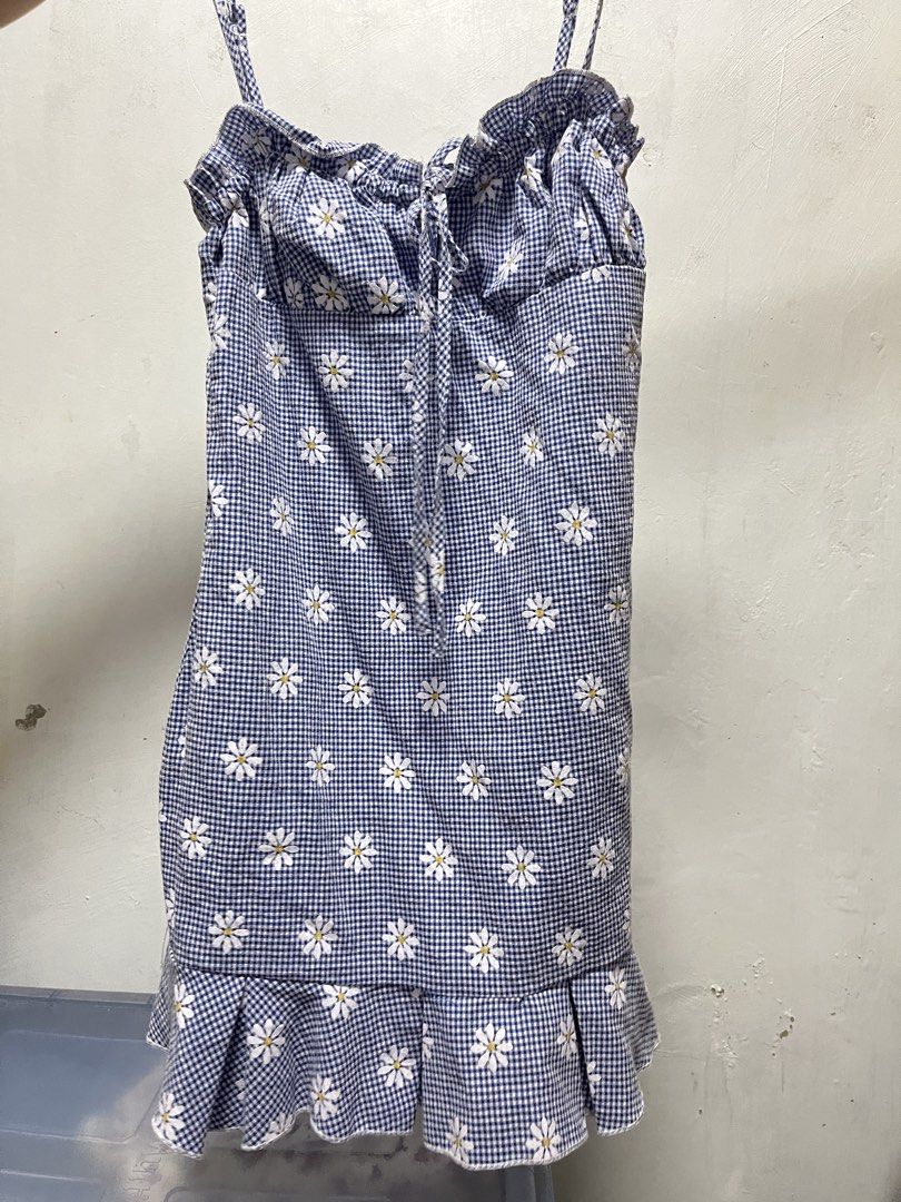 Daisy Print Mini Dress (Category: Dresses) located in Manila. Submitted by declutter_w_sam (Listing ID 1423031587, Image 1). Description: - Blue gingham mini dress - Adorable daisy print - Adjustable spaghetti straps - Feminine ruffled hem - Tie detail at the bust - Lightweight and breezy fabric - Ideal for warm weather.