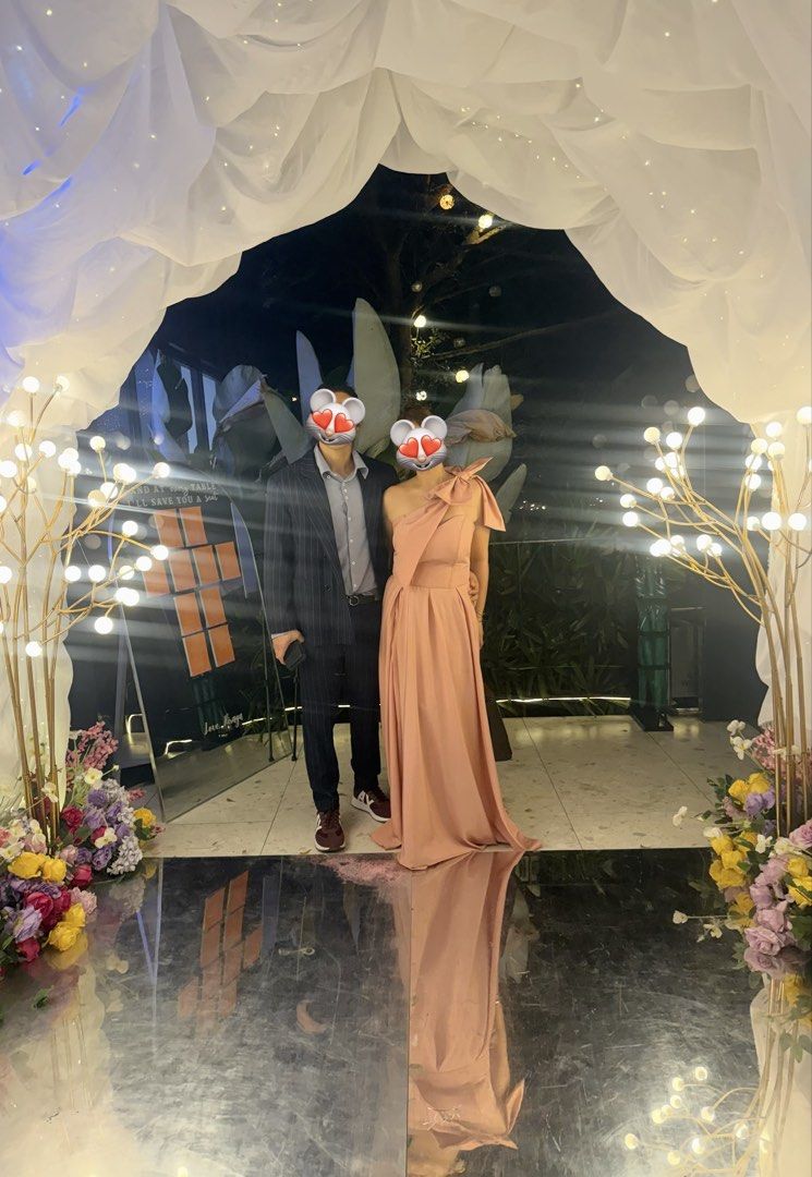 Dusty Rose One-Shoulder Maxi Gown (Category: Dresses) located in Mandaluyong City. Submitted by mindfully_decluttering (Listing ID 1422953251, Image 3). Description: - Elegant dusty rose maxi dress - One-shoulder design with a large bow - Flowing, satin-like fabric - Features a side slit - Ideal for weddings and special occasions - Used once only.