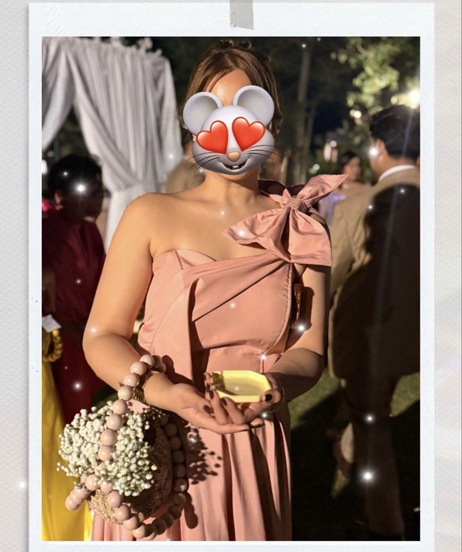 Dusty Rose One-Shoulder Maxi Gown (Category: Dresses) located in Mandaluyong City. Submitted by mindfully_decluttering (Listing ID 1422953251, Image 1). Description: - Elegant dusty rose maxi dress - One-shoulder design with a large bow - Flowing, satin-like fabric - Features a side slit - Ideal for weddings and special occasions - Used once only.