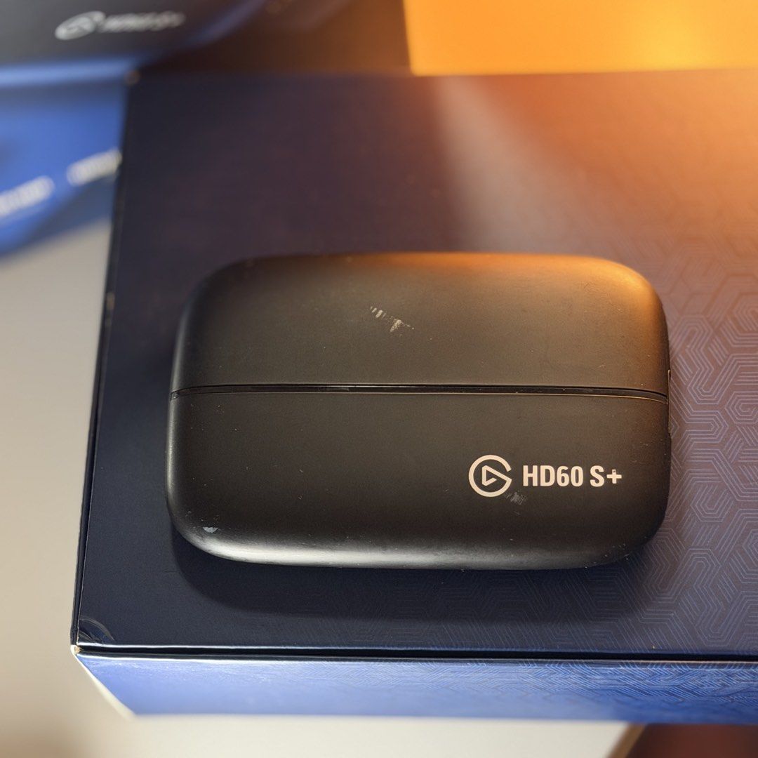 Elgato HD60 S+ Capture Card (Category: Other Accessories) located in Cabuyao City. Submitted by ivyyvon (Listing ID 1423013842, Image 2). Description: - Elgato HD60 S+ capture card - Record and stream your gameplay - Black color - Includes original box - Designed for seamless gameplay and content creation.