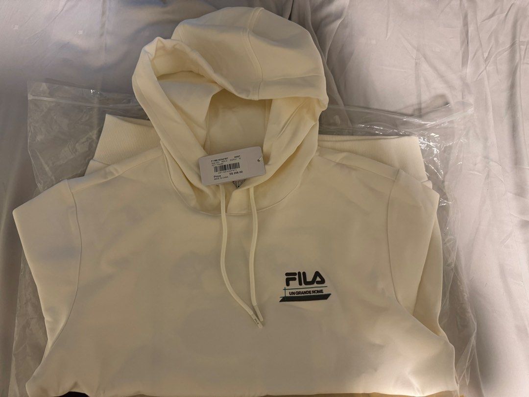 Fila Pullover Jacket (Category: Coats, Jackets and Outerwear) located in Singapore. Submitted by yugyu (Listing ID 1422969419, Image 1). Description: Selling off this brand new fila hoodie pullover Got it as gift. Retail price $208 letting go at $100 can check first when meet up 100% authentic..