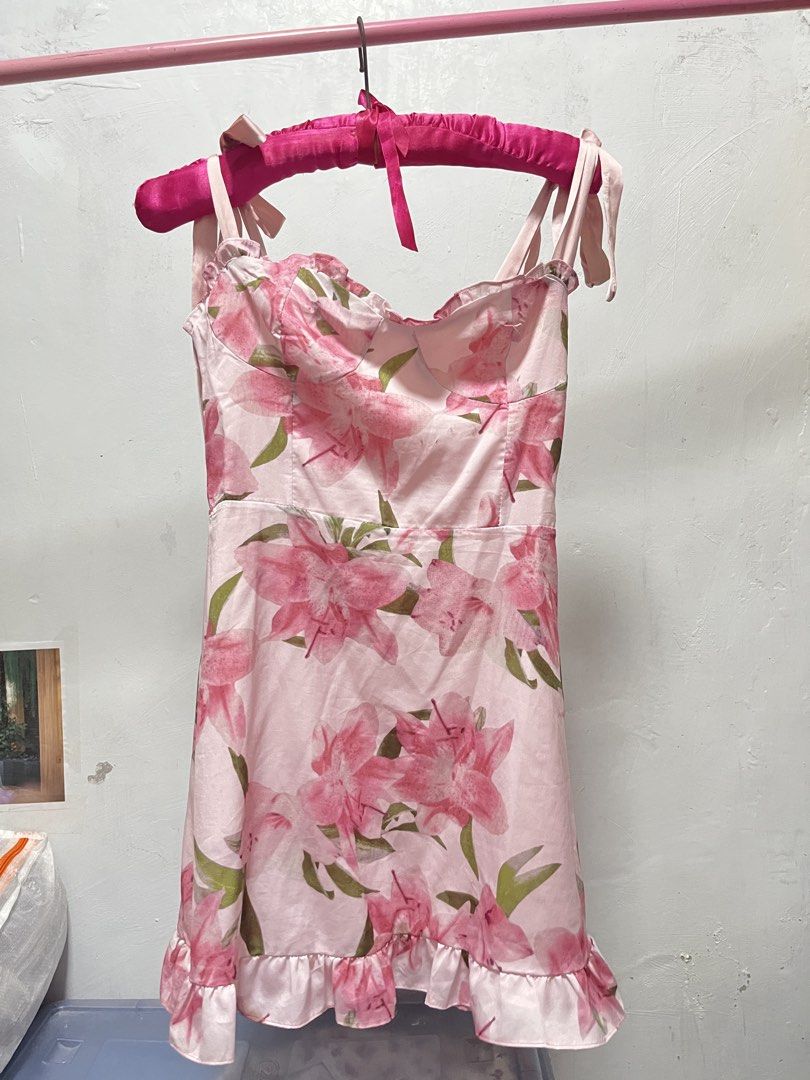 Floral Print Mini Dress (Category: Dresses) located in Manila. Submitted by declutter_w_sam (Listing ID 1423031422, Image 1). Description: - Floral print mini dress - Pink and green color scheme - Features tie straps - Ruffled hem detail - Lightweight fabric - Ideal for warm weather and casual events.