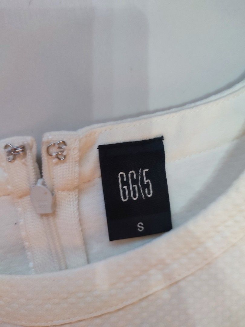 GG5 White Dress - Size S (Category: Dresses) located in Narvacan. Submitted by jigger85 (Listing ID 1422932450, Image 3). Description: White dress from GG5. Features a sleeveless design with a round neckline. The dress has a fitted bodice and a flared skirt. It includes a zipper closure at the back. The size is S. dimes: chest :32 waist : 26 lenght: 32.