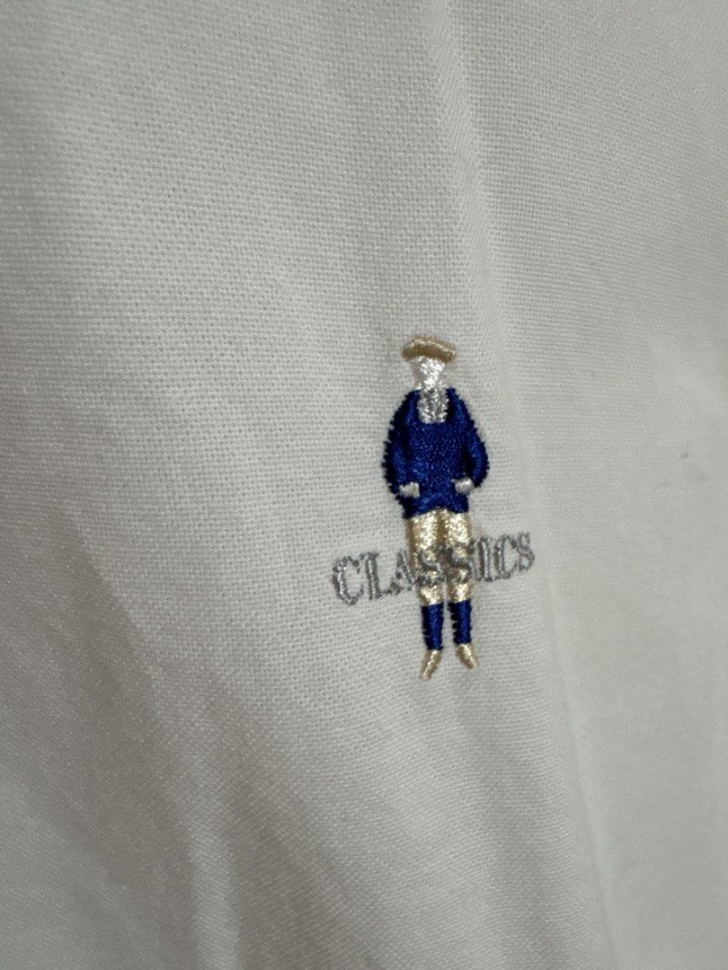 Giordano Classics White Long Sleeve Shirt (Category: Longsleeves) located in Malolos. Submitted by bmnld (Listing ID 1422965434, Image 2). Description: - White long sleeve shirt - Unique collar design - Small embroidered logo - Button-down front - Lightweight fabric - Perfect for warmer weather - Classic and versatile.