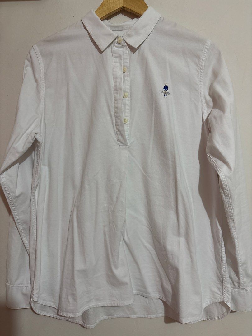 Giordano Classics White Long Sleeve Shirt (Category: Longsleeves) located in Malolos. Submitted by bmnld (Listing ID 1422965434, Image 1). Description: - White long sleeve shirt - Unique collar design - Small embroidered logo - Button-down front - Lightweight fabric - Perfect for warmer weather - Classic and versatile.