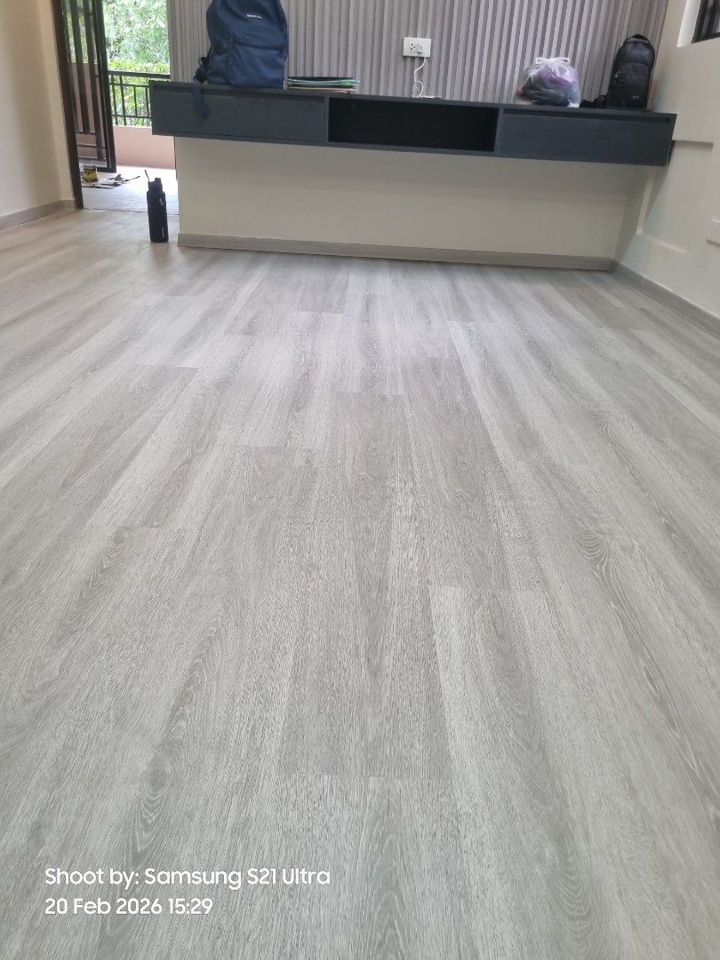 Grey Wood-look Vinyl Flooring Spc (Category: Carpets, Mats & Flooring) located in Valenzuela. Submitted by ezfloorwork (Listing ID 1422973382, Image 3). Description: - Grey wood-look vinyl flooring - Modern and clean design - Suitable for kitchen and living areas - Light grey color with wood grain details - Easy to maintain - Complements various interior design styles.