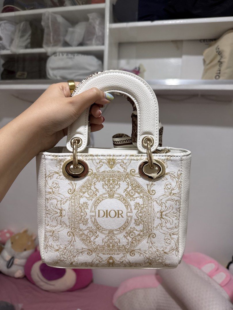 GWP/VIP Dior Lady Dior Handbag (Category: Luxury Bags & Wallets) located in Marilao. Submitted by anp129 (Listing ID 1423061923, Image 2). Description: GWP/VIP Dior Beauty Handbag - brand new - includes box, gold chain, twilly, bag balloon puff.