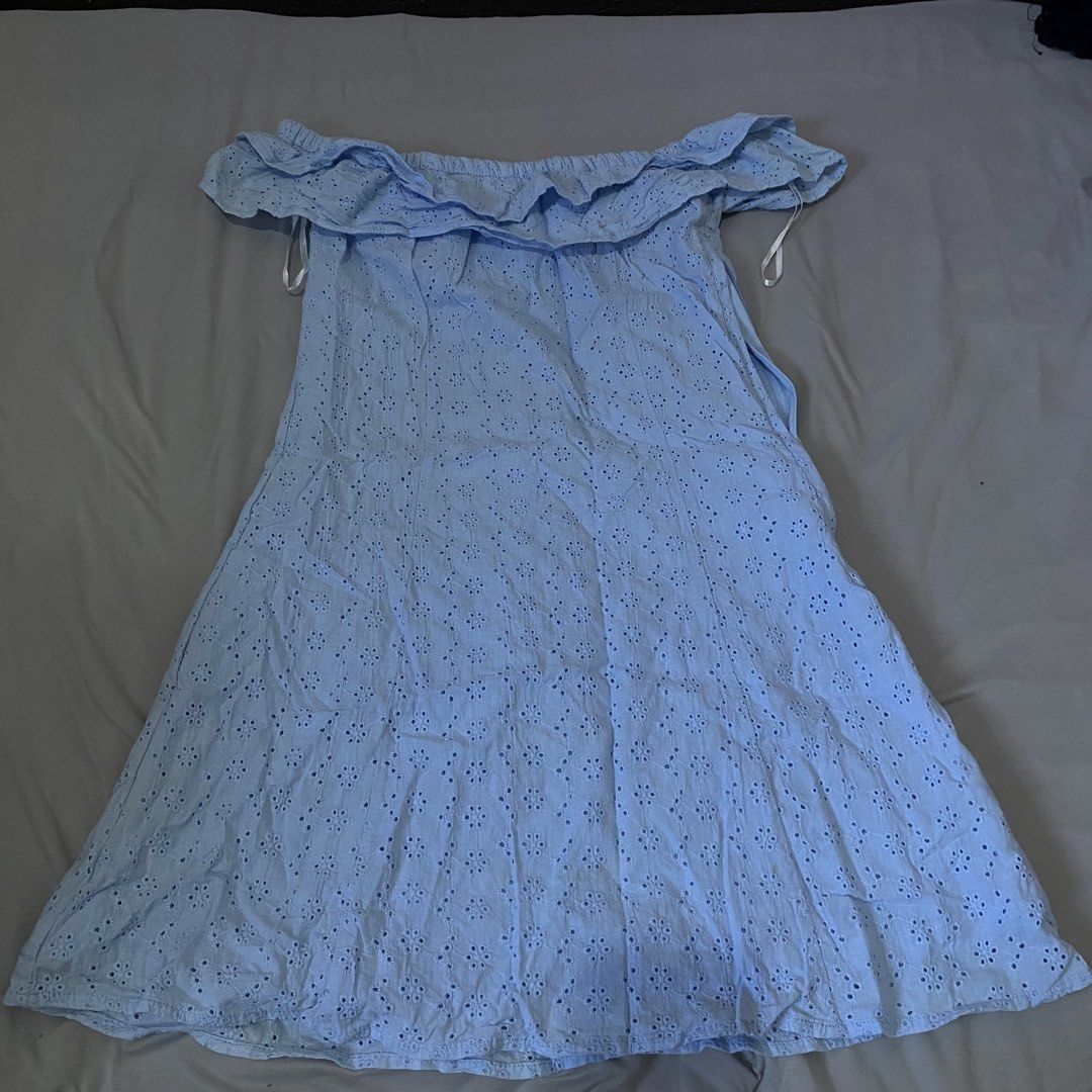 H&M Divided Off-Shoulder Dress (Category: Dresses) located in Baguio. Submitted by shoppelainee (Listing ID 1422919353, Image 1). Description: - H&M Divided dress - Off-shoulder design - Light blue color - Ruffled neckline - Flowy silhouette - Eyelet pattern - Lightweight fabric - Perfect for warm weather.