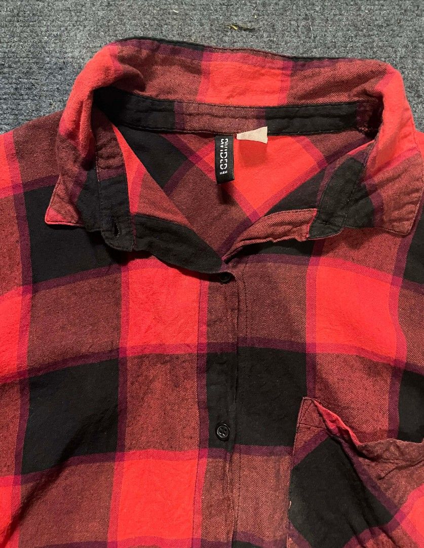 H&M Red and Black Plaid Shirt (Category: Shirts) located in Baguio. Submitted by kurt_7 (Listing ID 1423005303, Image 2). Description: - H&M plaid shirt - Classic red and black pattern - Collared neckline - Button-down closure - Single chest pocket - Long sleeves with buttoned cuffs - Made of woven fabric - Tag visible in photos No issue.